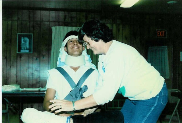 What is Cheryl doing? 1986 Advanced First Aid class at the station.